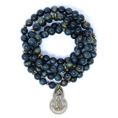 Blue Tiger Eye Mala beads with antique brass details, small Om charm and Quan Yin pendant.