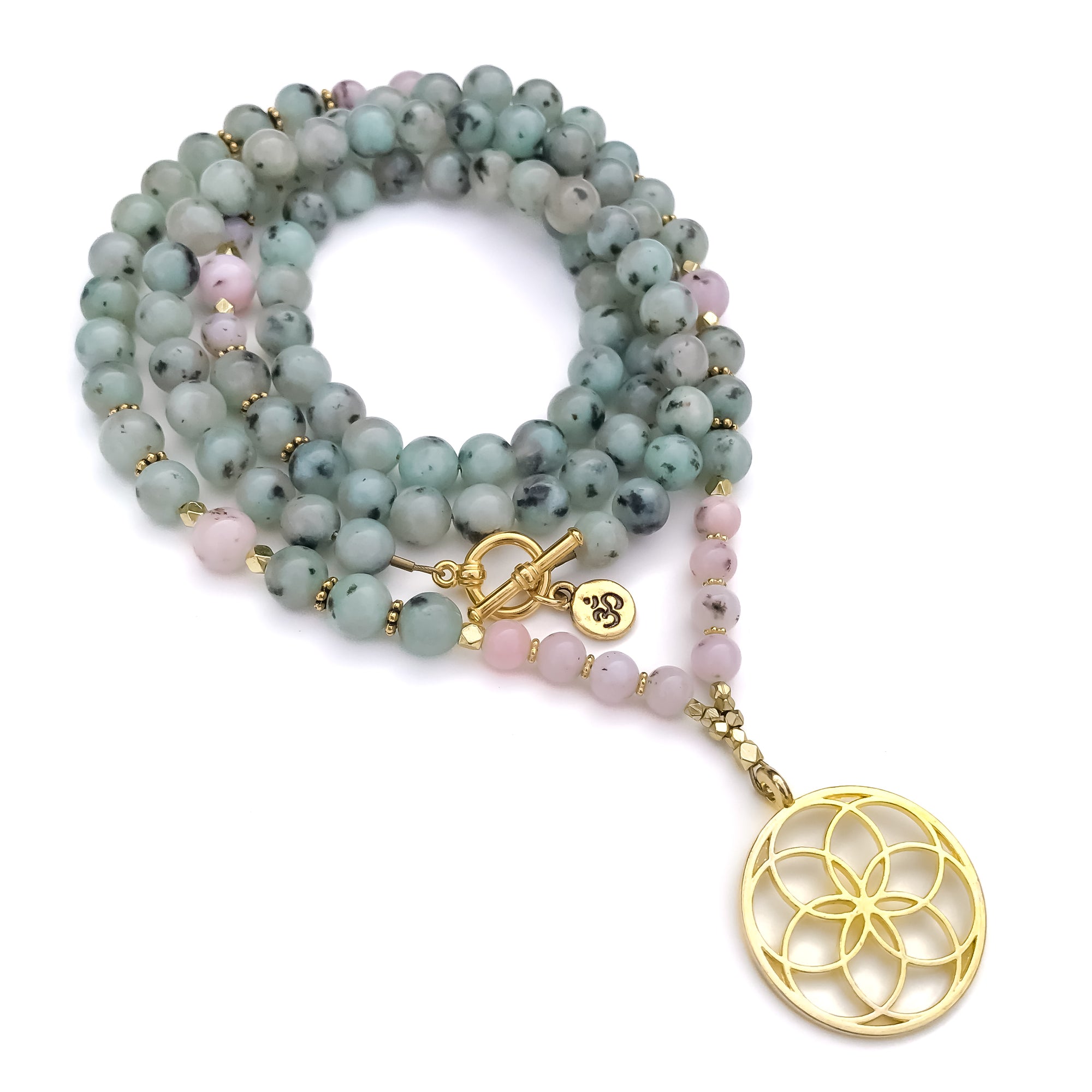 A 108 beaded necklace with light blue-green kiwi Jasper and pink opal gemstones, accented with small gold spacer beads and a gold-tone flower motif pendant, displayed on a clean white background.