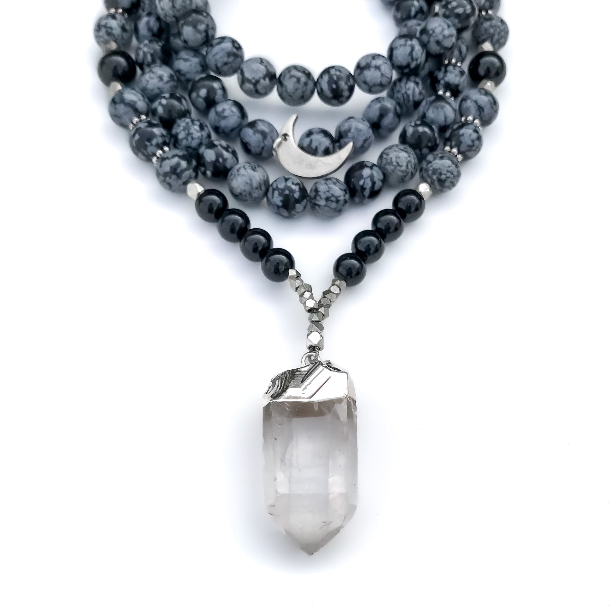 Beaded Necklace with snowflake obsidian and black onyx , a clear quartz crystal pendant, silver accents and silver moon charm.
