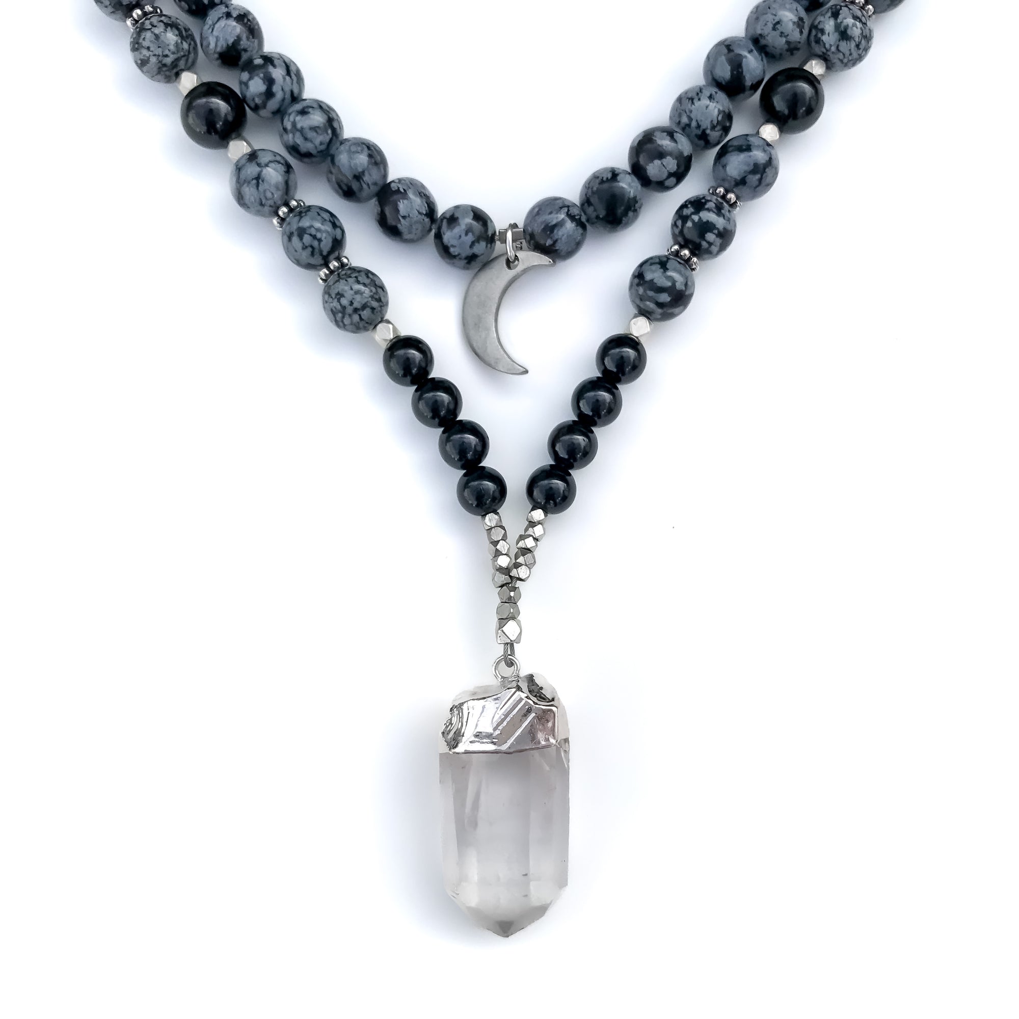 Mala Necklace with black and gray gemstone beads and a clear crystal pendant on a white background