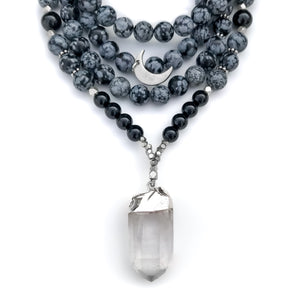 108 mantra beads handmade with snowflake obsidian and black onyx beads featuring quartz point pendant and crescent moon charm with silver accents.