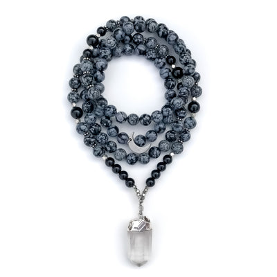 Black and grey Snowflake Obsidian and Black Onyx gemstone beads Mala Necklace with quartz crystal pendant and silver accents.