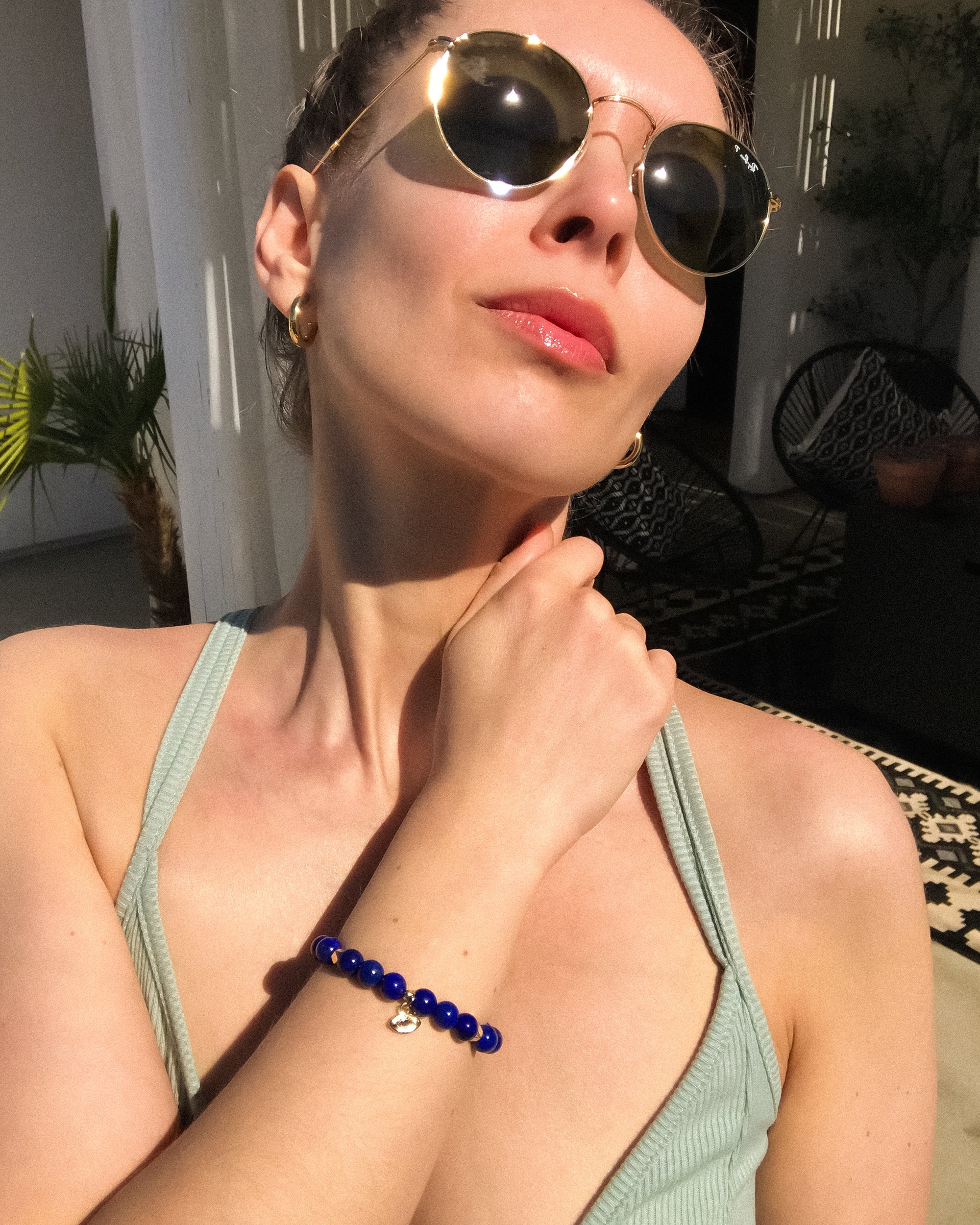 Lapis Lazuli Mala Bracelet with gold evil eye charm and gold accents, spiritual jewelry by Mishka Samuel