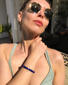 Lapis Lazuli Mala Bracelet with gold evil eye charm and gold accents, spiritual jewelry by Mishka Samuel