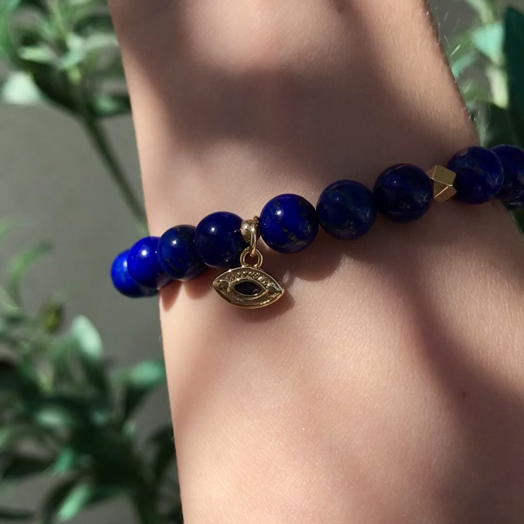 Lapis Lazuli mala bracelet with gold evil eye charm and gold faceted accents, spiritual jewelry by Mishka Samuel