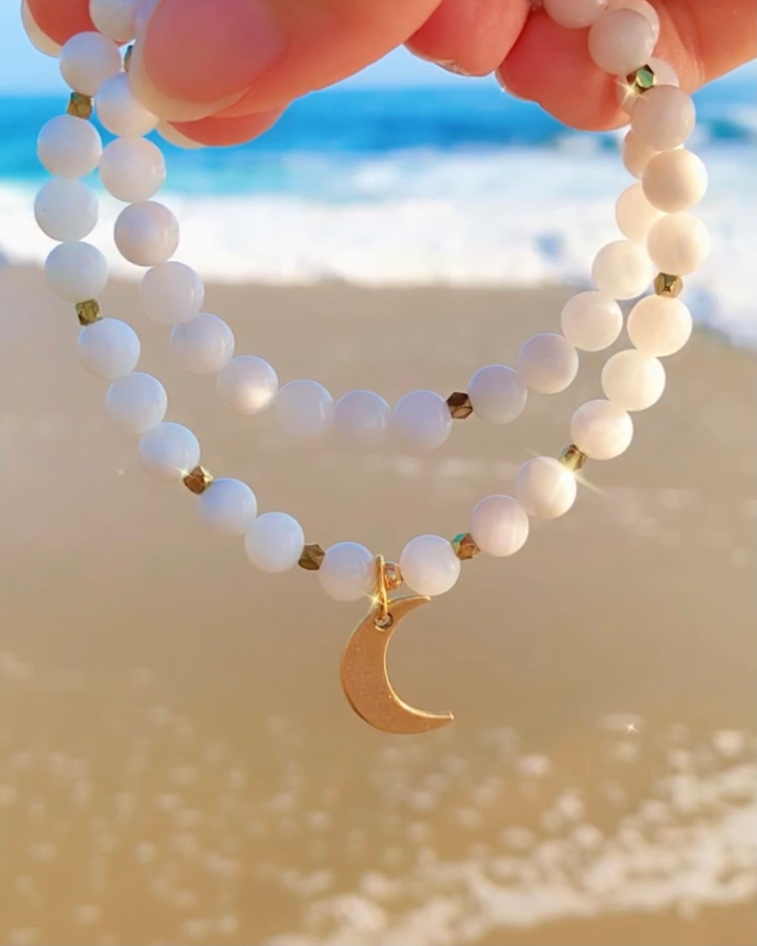 Double wrap natural Moonstone beaded bracelet with gold crescent moon pendant.