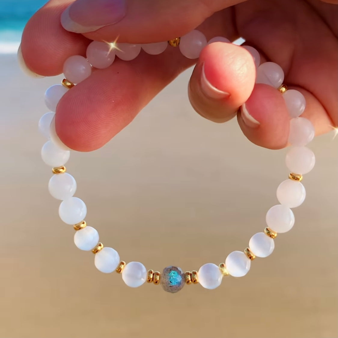 White Moonstone and Selenite yoga bracelet with a faceted Labradorite focal bead. Gold or sterling silver accents.
