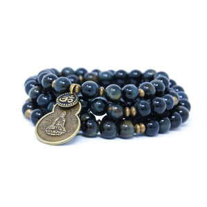 Blue Tiger Eye Mala beads with antique brass details, small Om charm and Quan Yin pendant.