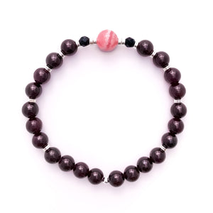 Natural crystal bracelet made with deep red Garnet, pink Rhodochrosite and Black Onyx beads and sterling silver accents.